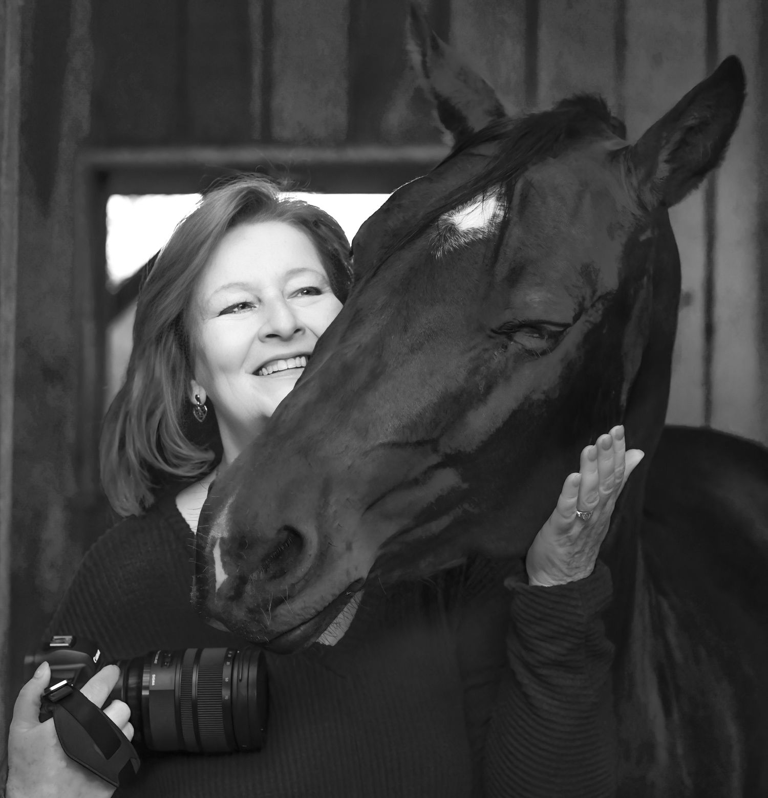 Photo of photographer Debbie Karnes from Middle Tennessee with a horse trying to eat her camera.