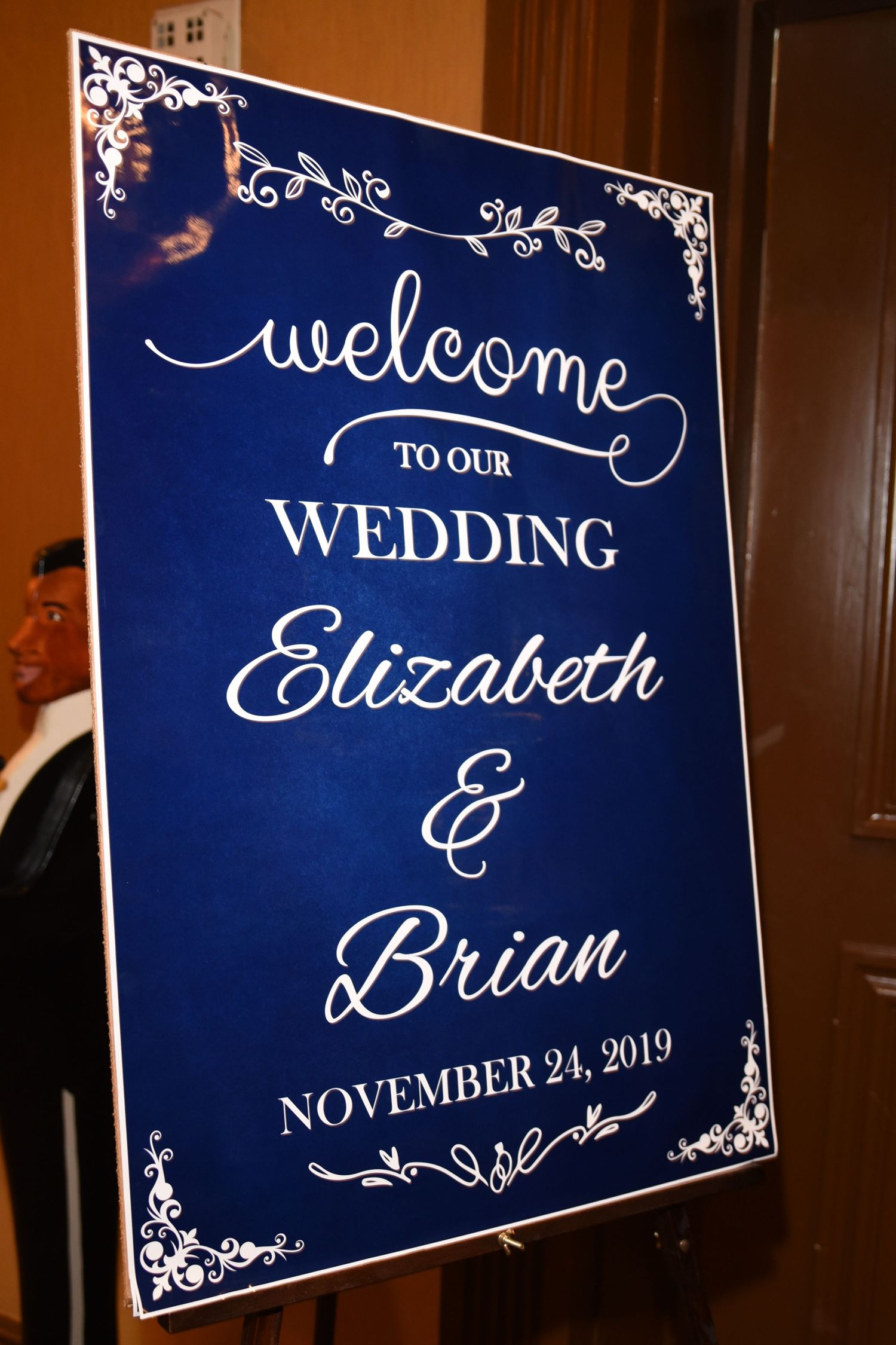 Navy blue wedding welcome signs with elegant white calligraphy and decorative borders.