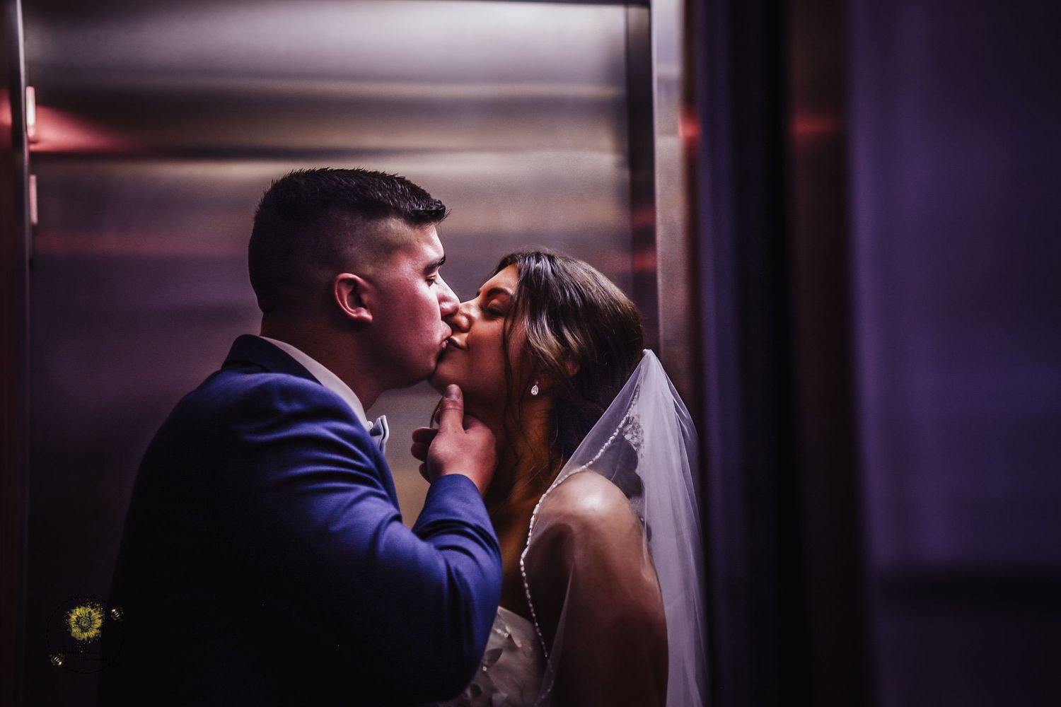 Romantic wedding portraits in a dimly lit indoor setting.