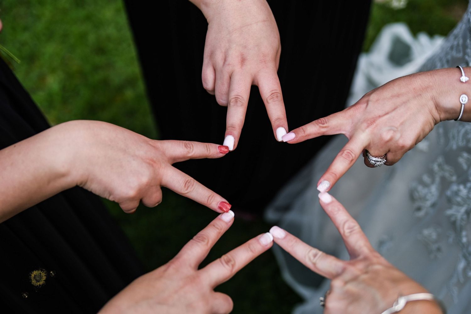 Close-up shots of hands exchanging rings during a wedding ceremony.