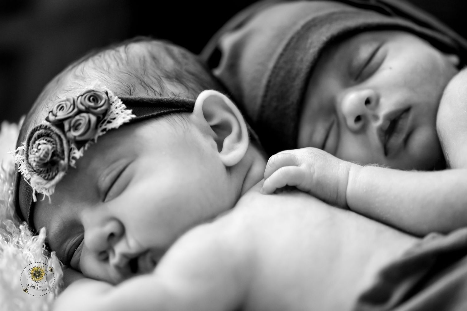 A series of black and white photos showing a sleeping newborn baby in different poses and angles.