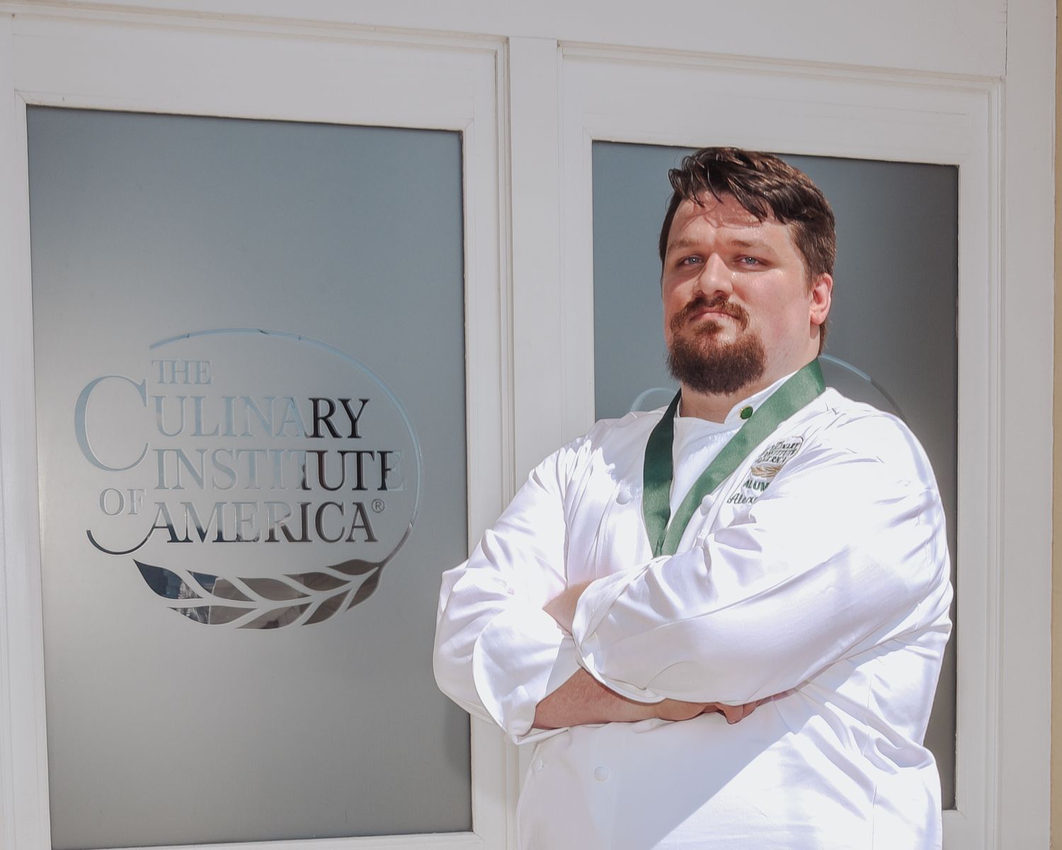 A series of professional headshots showing medical staff in white coats against a light background.