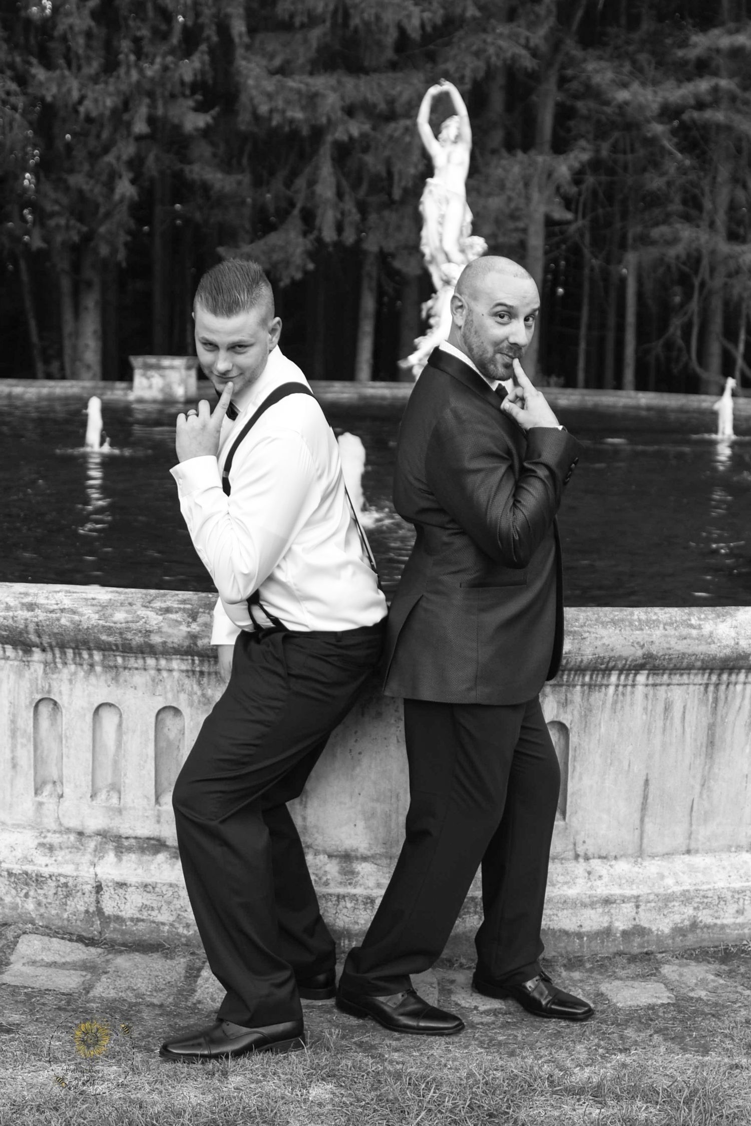 Black and white sequence showing playful poses by a fountain ledge.