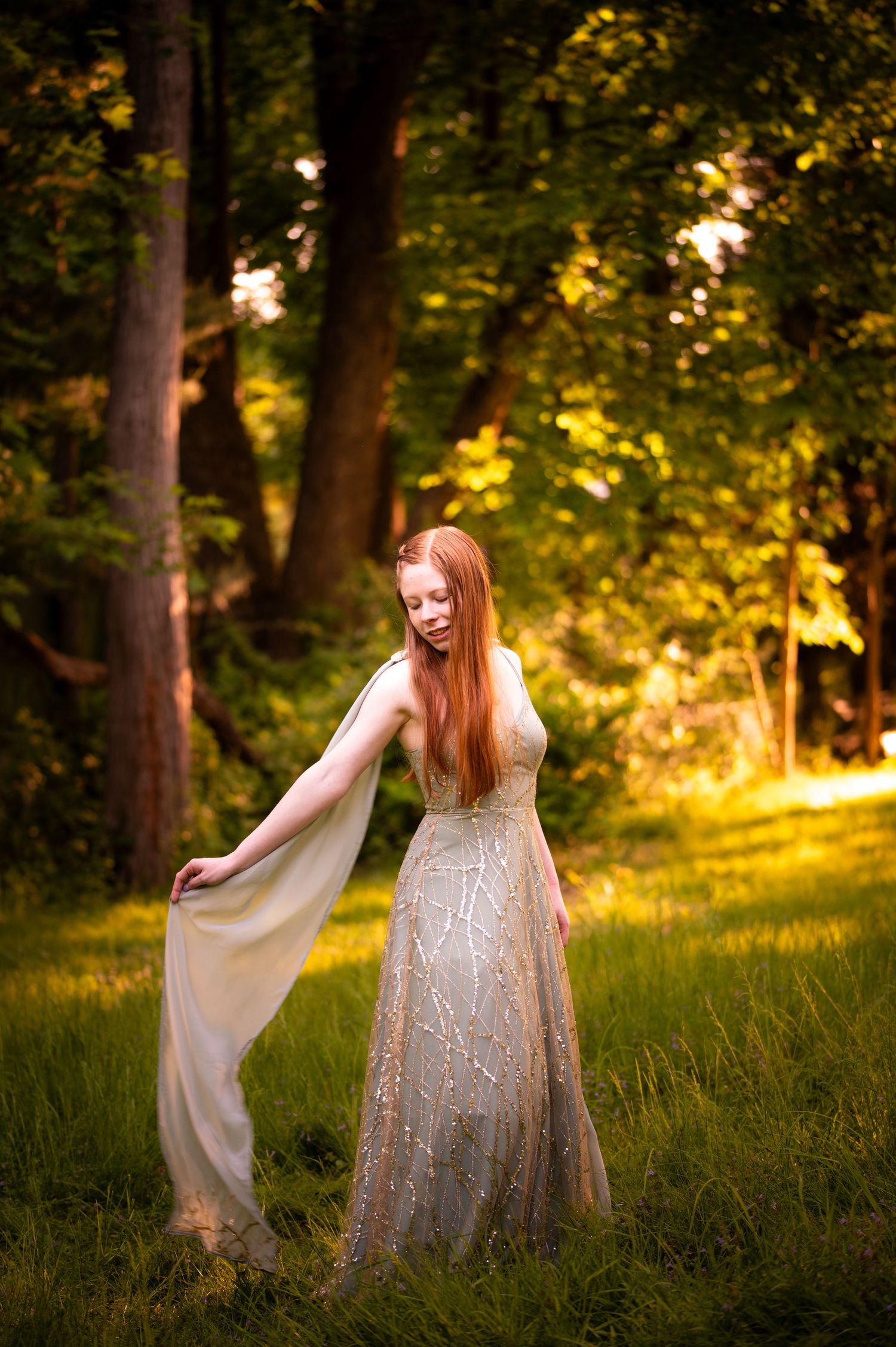 A figure in a sparkly white dress twirls gracefully in a sunlit forest clearing during golden hour.