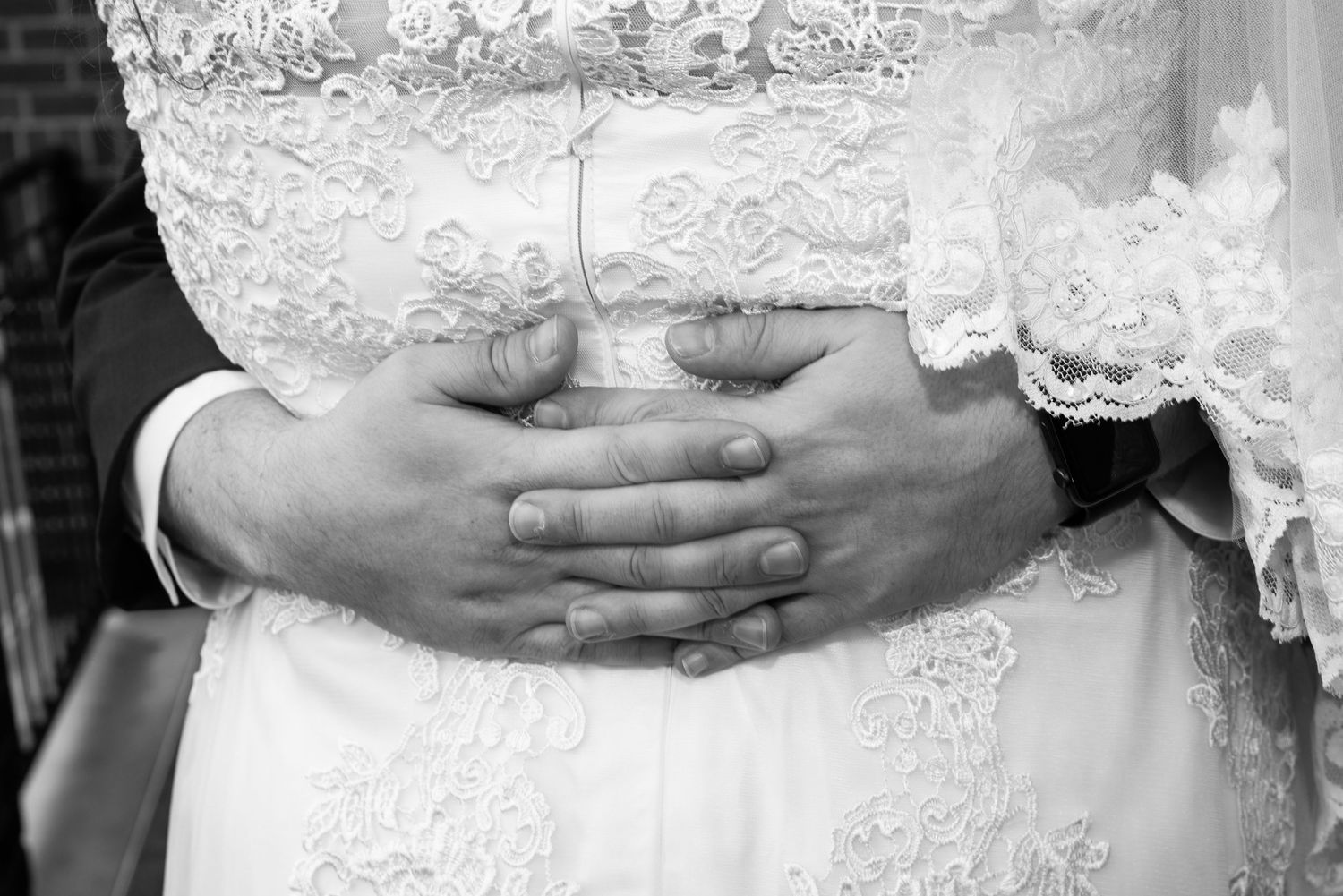Detail shots of intricate lace wedding dress with delicate beading and embellishments.
