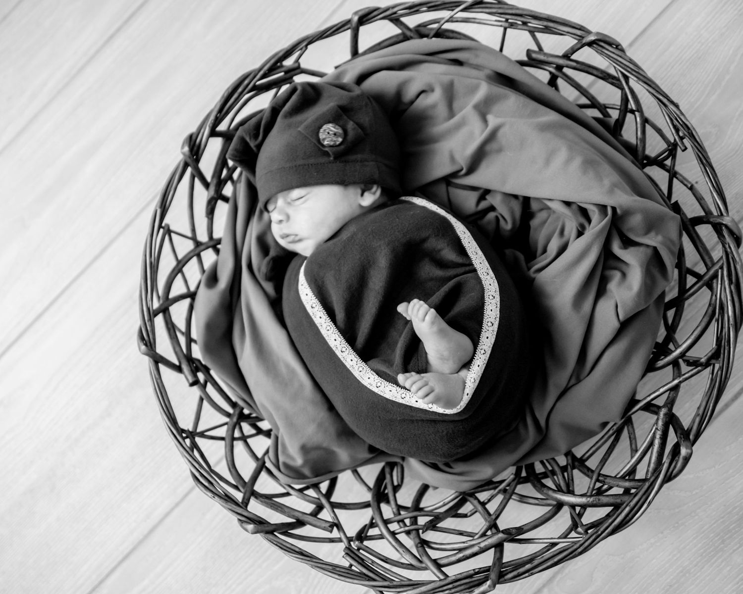 A black baseball cap lies crumpled on a white surface in a series of similar photos showing different angles.