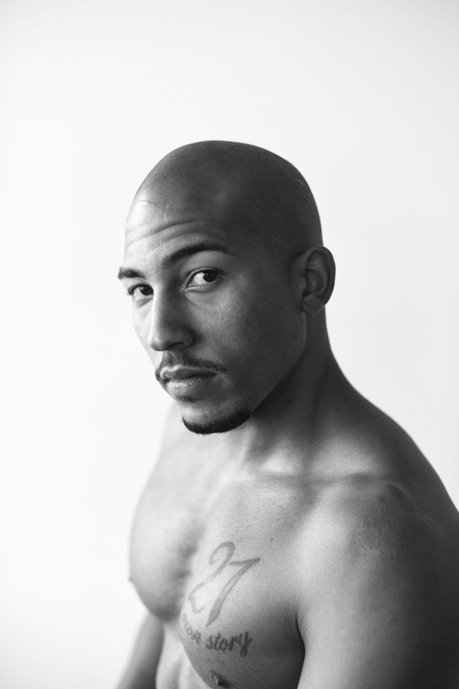 Black and white artistic portrait series showing shirtless person from different angles against white background.