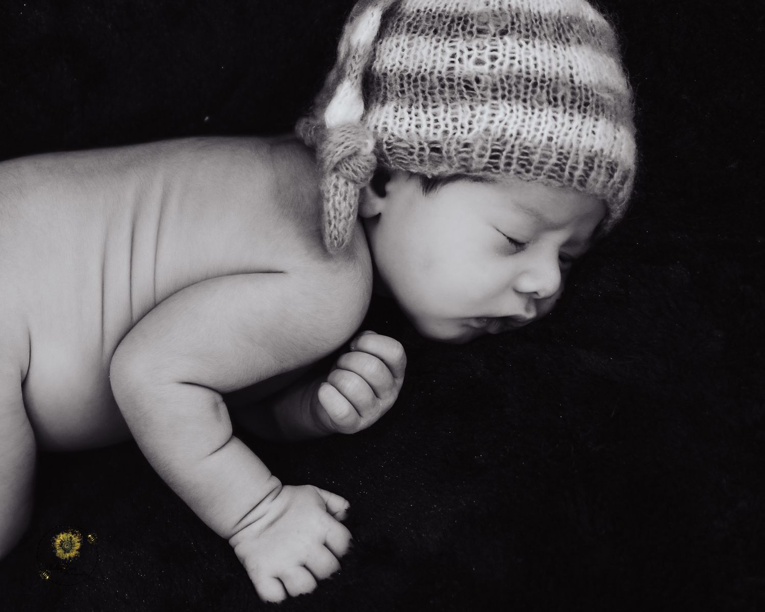 Black and white artistic photo series showing a sleeping baby in different peaceful poses wearing a knitted hat.