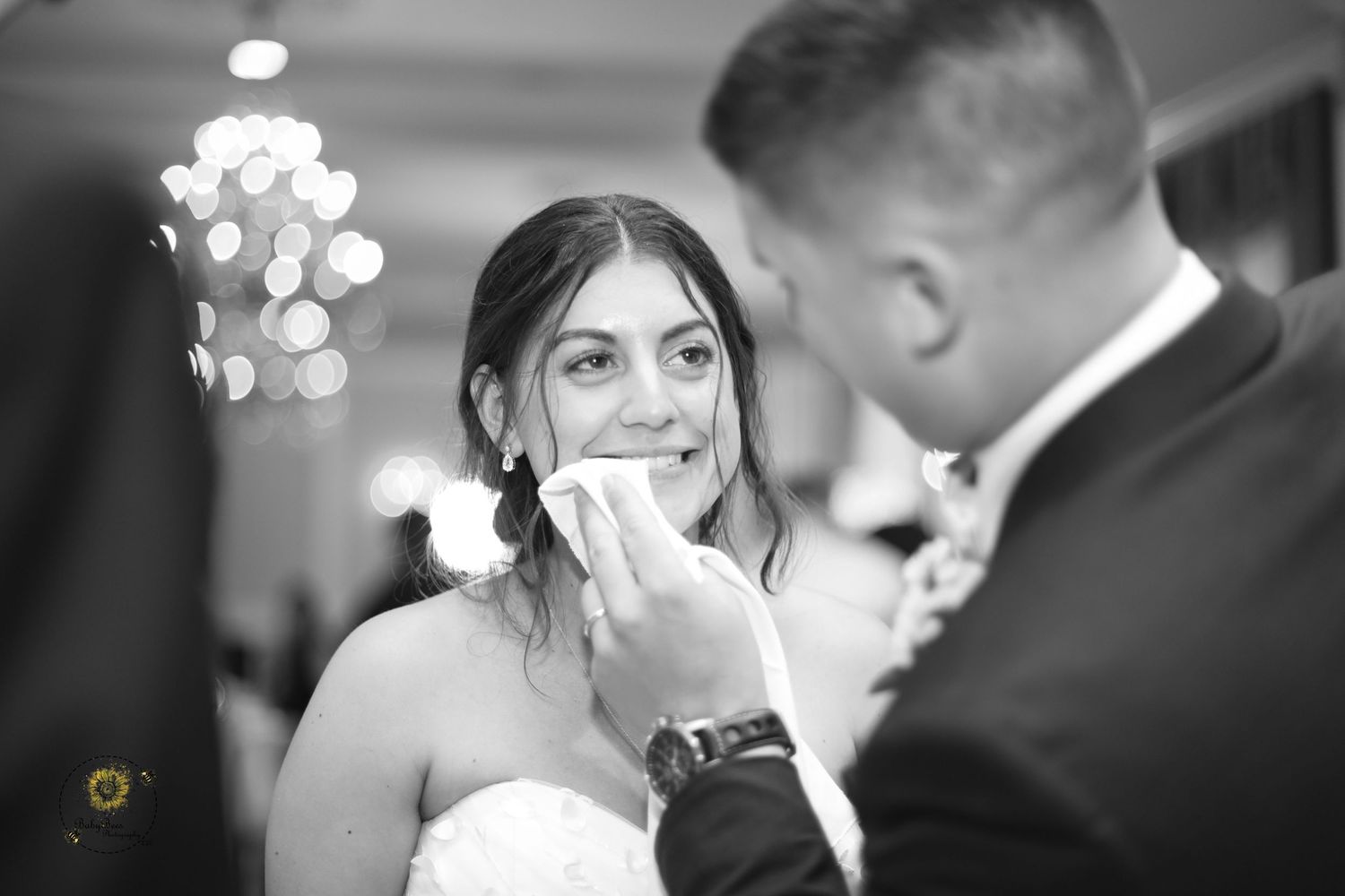 Black and white close-up shots capturing intimate wedding moments.