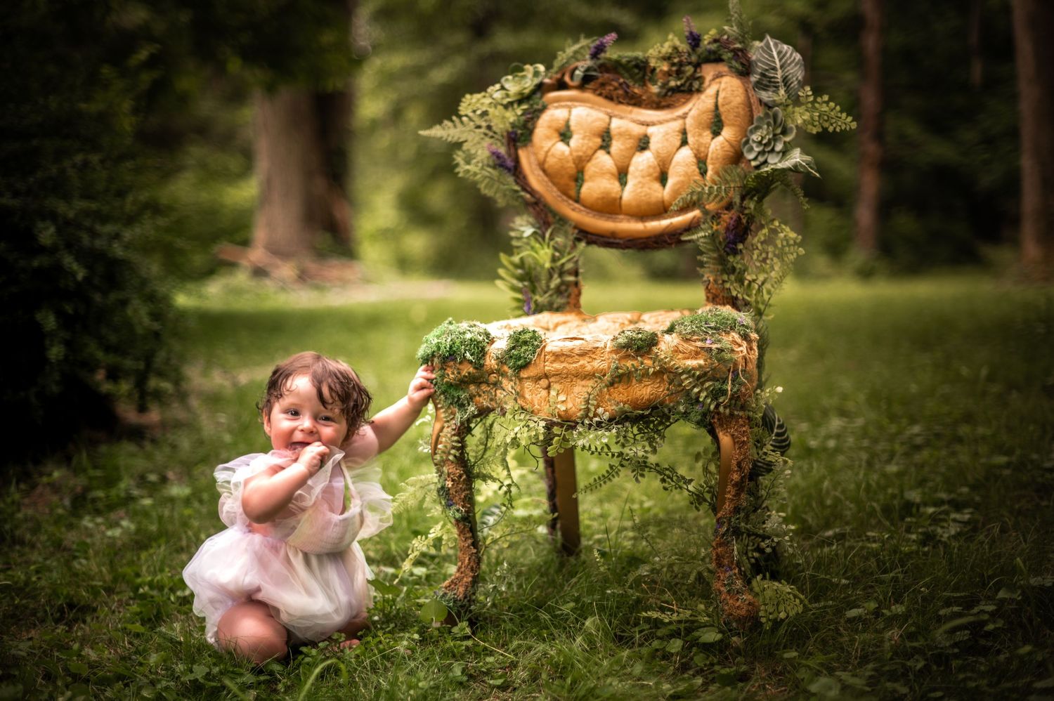 Whimsical woodland scene with pumpkins and floral decorations in a forest setting.