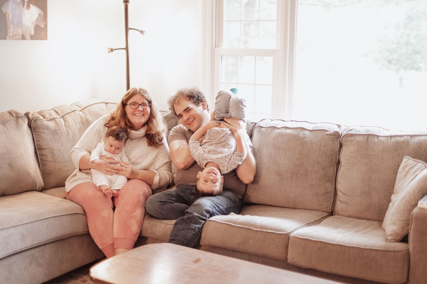 A series of candid moments on a cozy beige couch in a sunlit living room.
