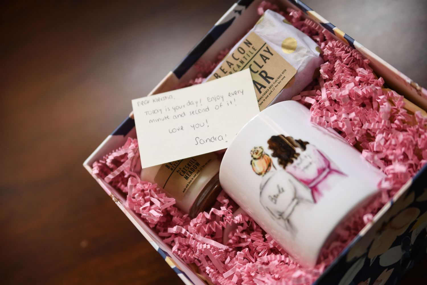 Wedding invitation suite with pink tissue paper and delicate calligraphy details.