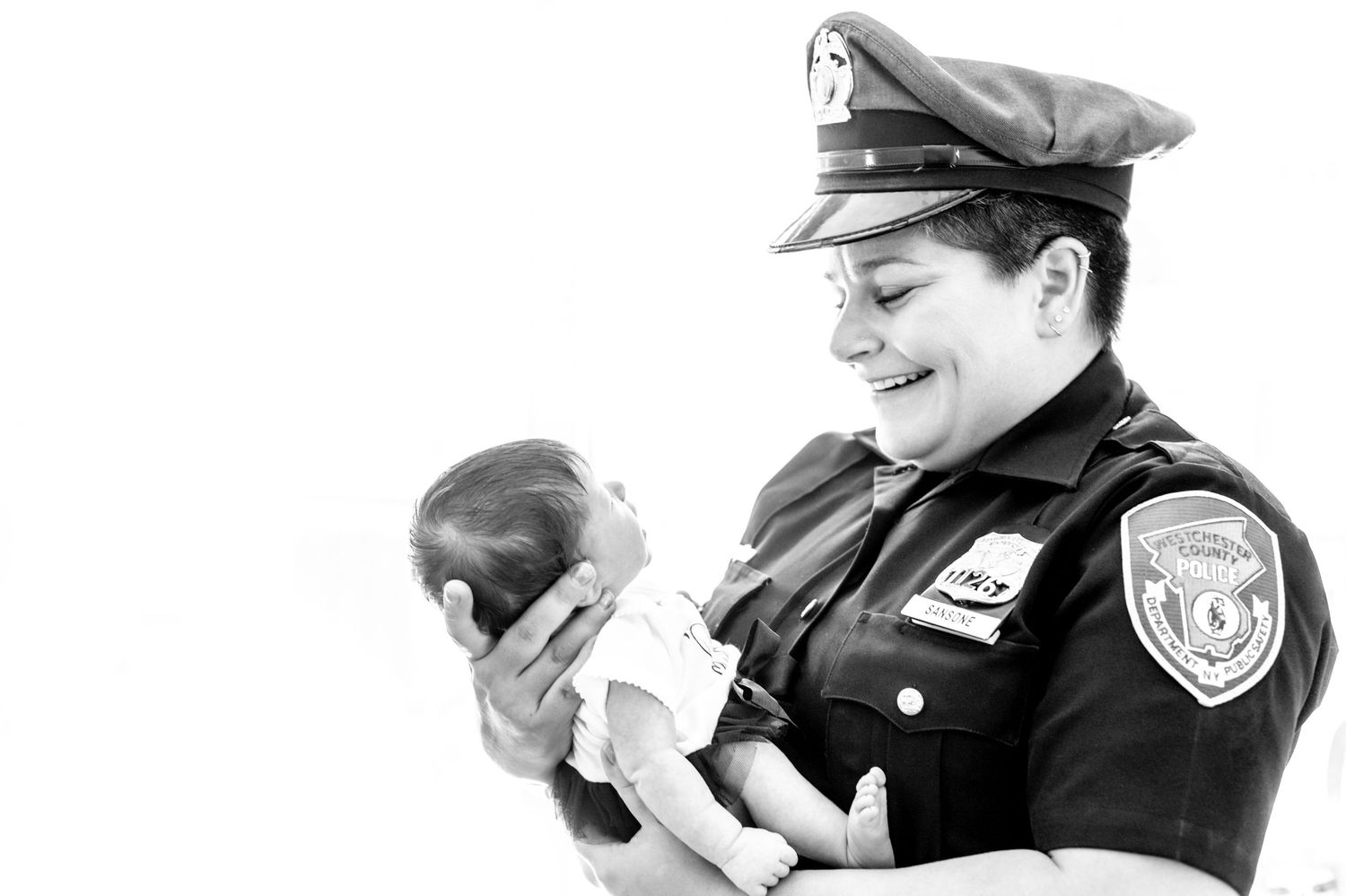 A collage of black and white images showing police officers and civilians interacting with children in various settings.