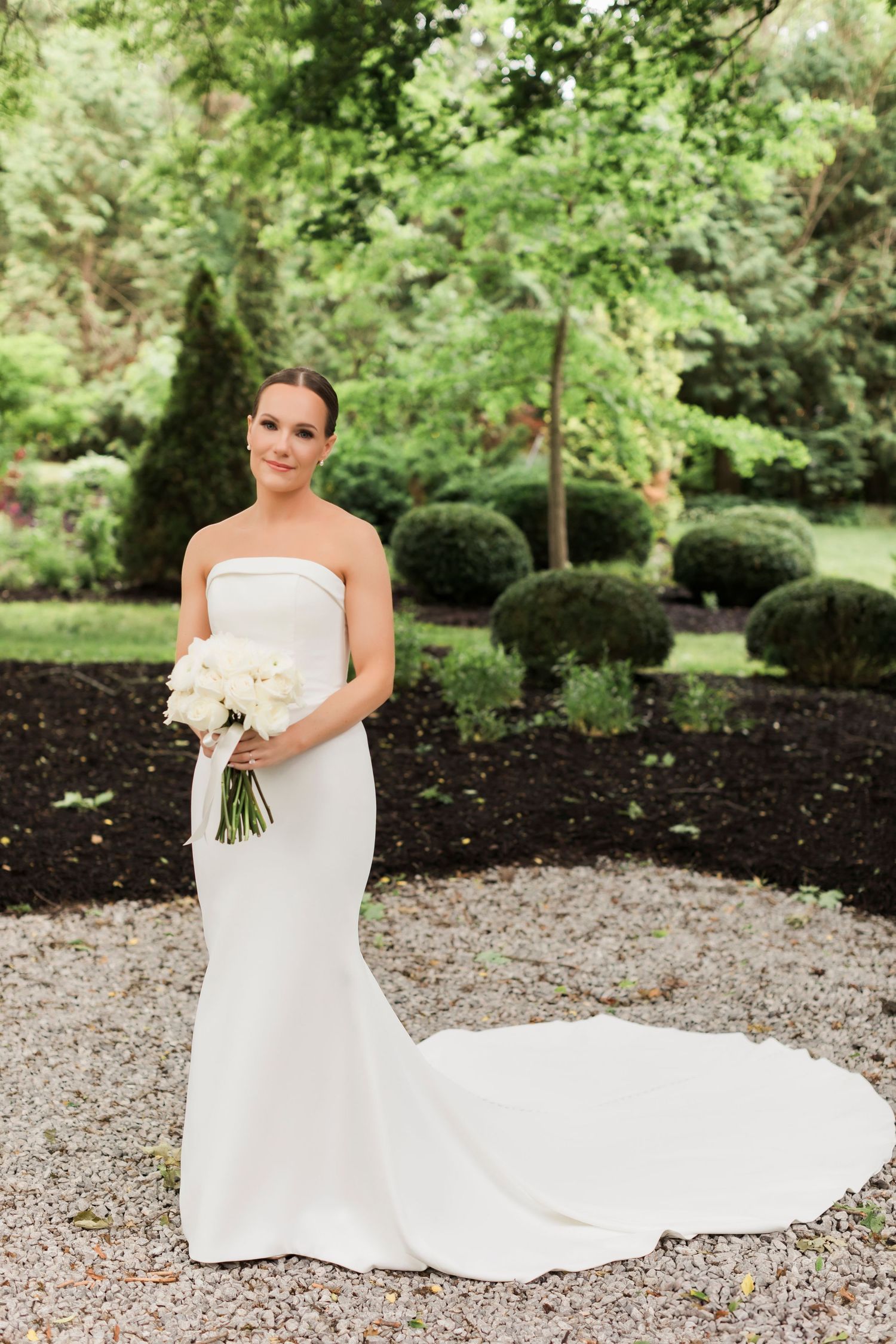 Row of romantic bridal portraits outdoors with a long white dress train against a garden backdrop.