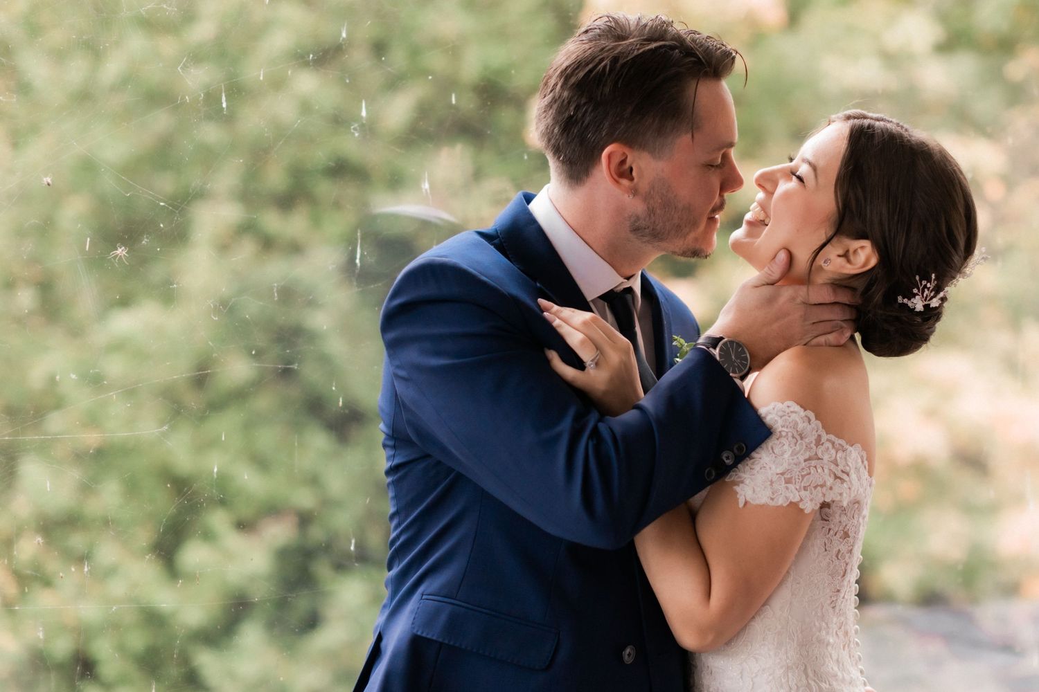 Romantic wedding portrait in navy and white with natural summer rain.