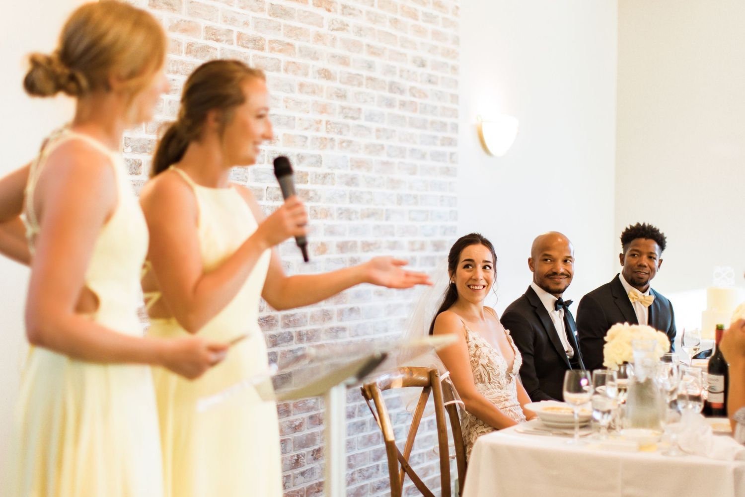 Wedding party members deliver emotional toasts during the reception celebration.