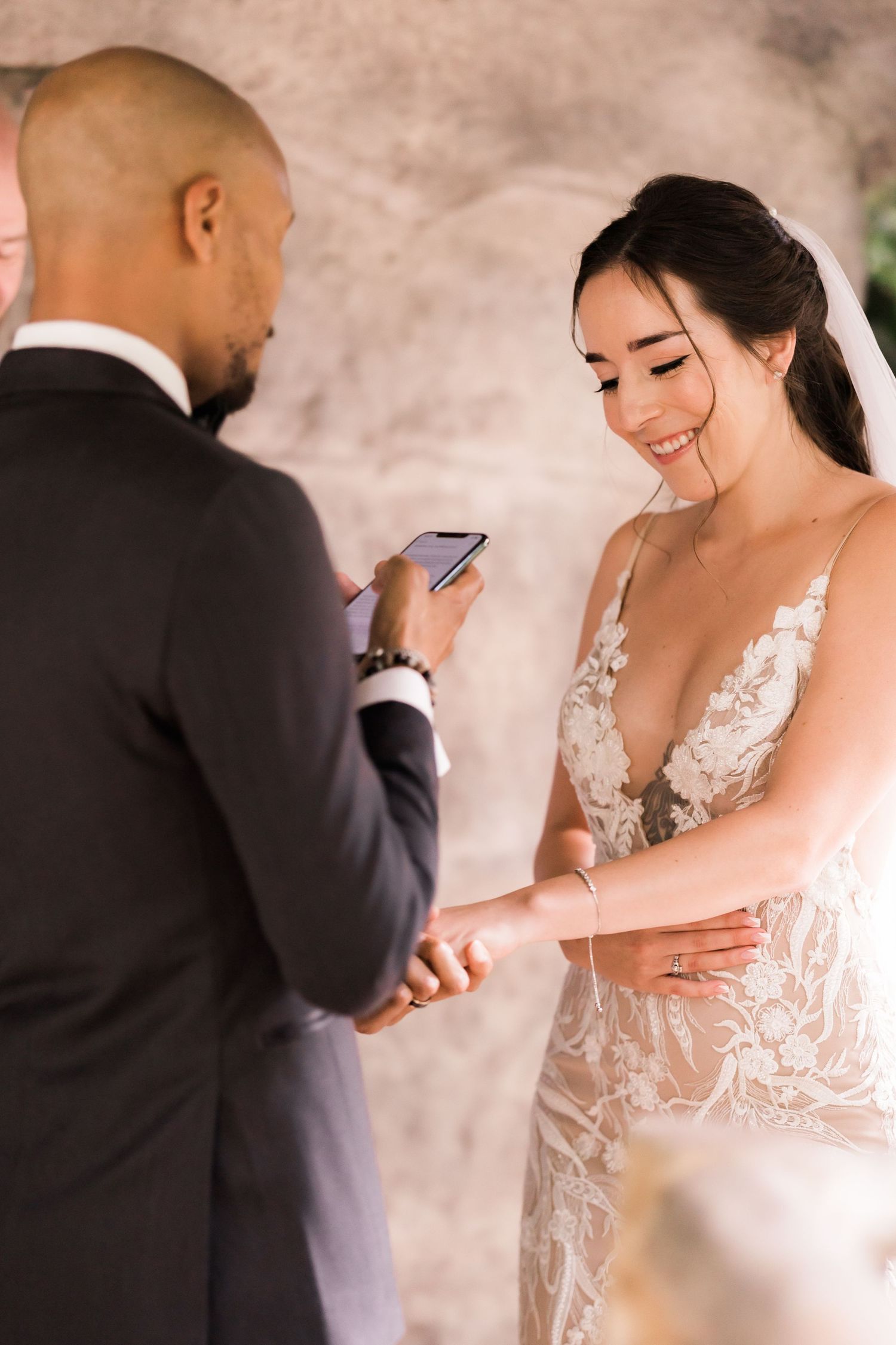 A couple shares an intimate moment exchanging vows during their wedding ceremony.