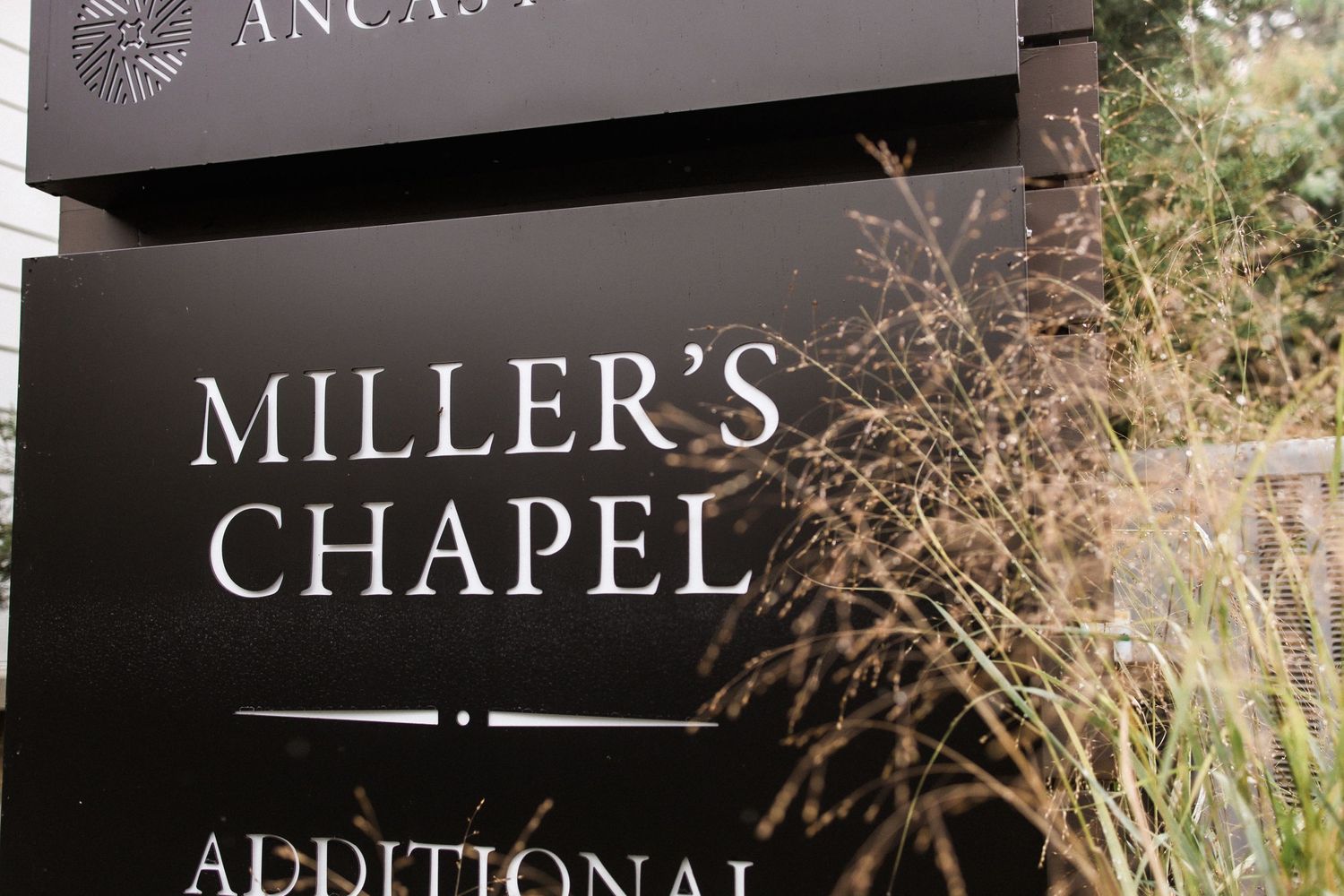 Black and white exterior signage for Miller's Chapel with elegant serif typography.