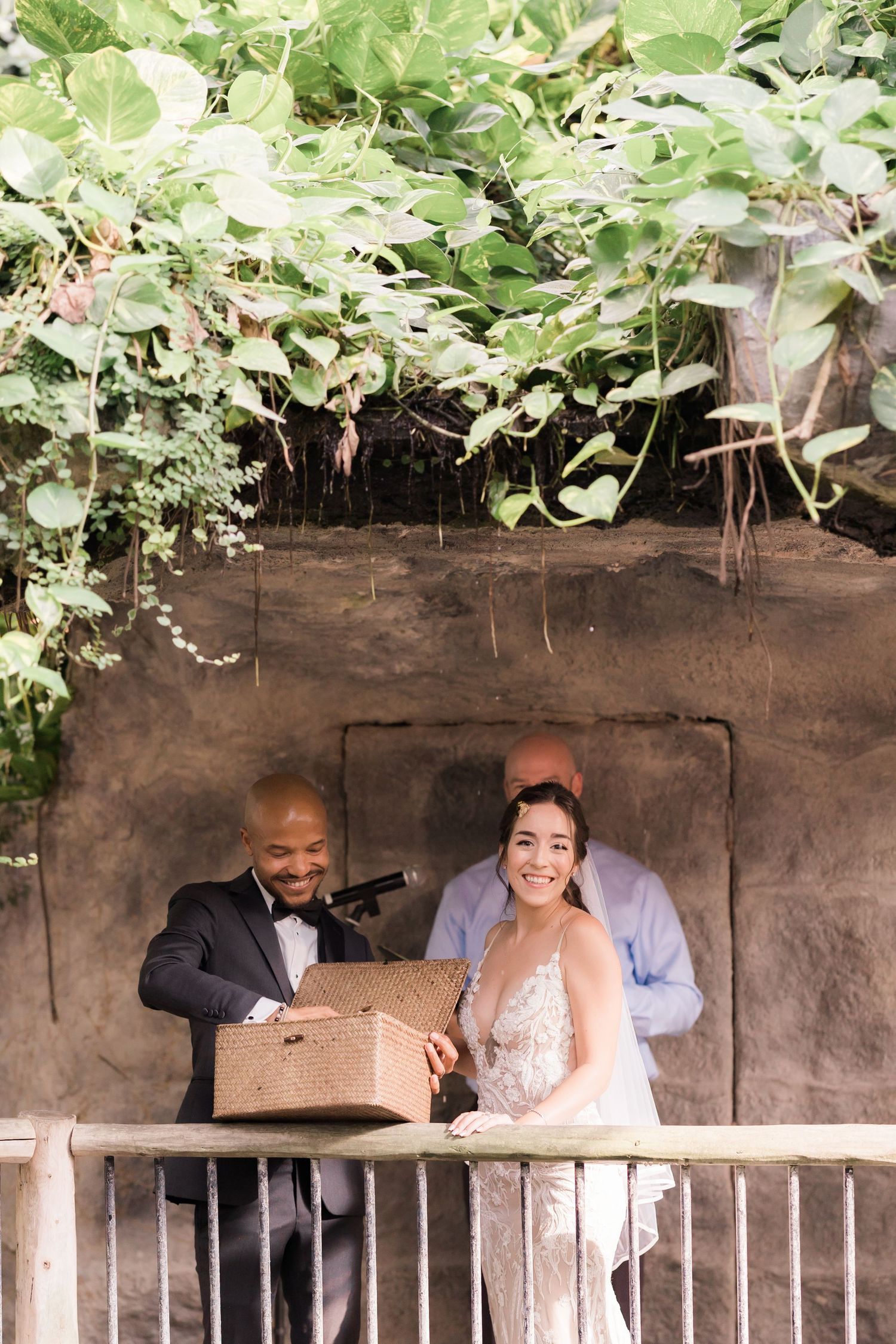 Couple sharing a lighthearted moment during their garden wedding ceremony.