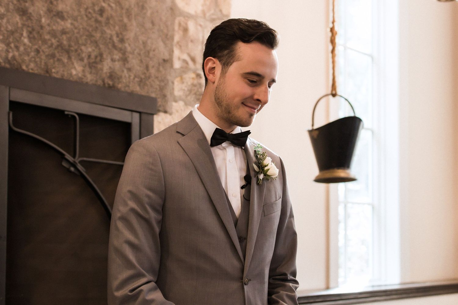 Side profile view in a rustic chapel setting with warm natural lighting.