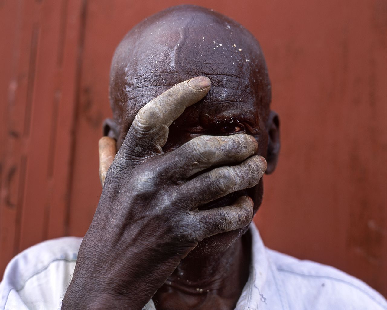 Montclair, The Mason. Port au Prince, Haiti 2001. While diminutive in stature, this man's Spirits -not to mention his hands- were massive