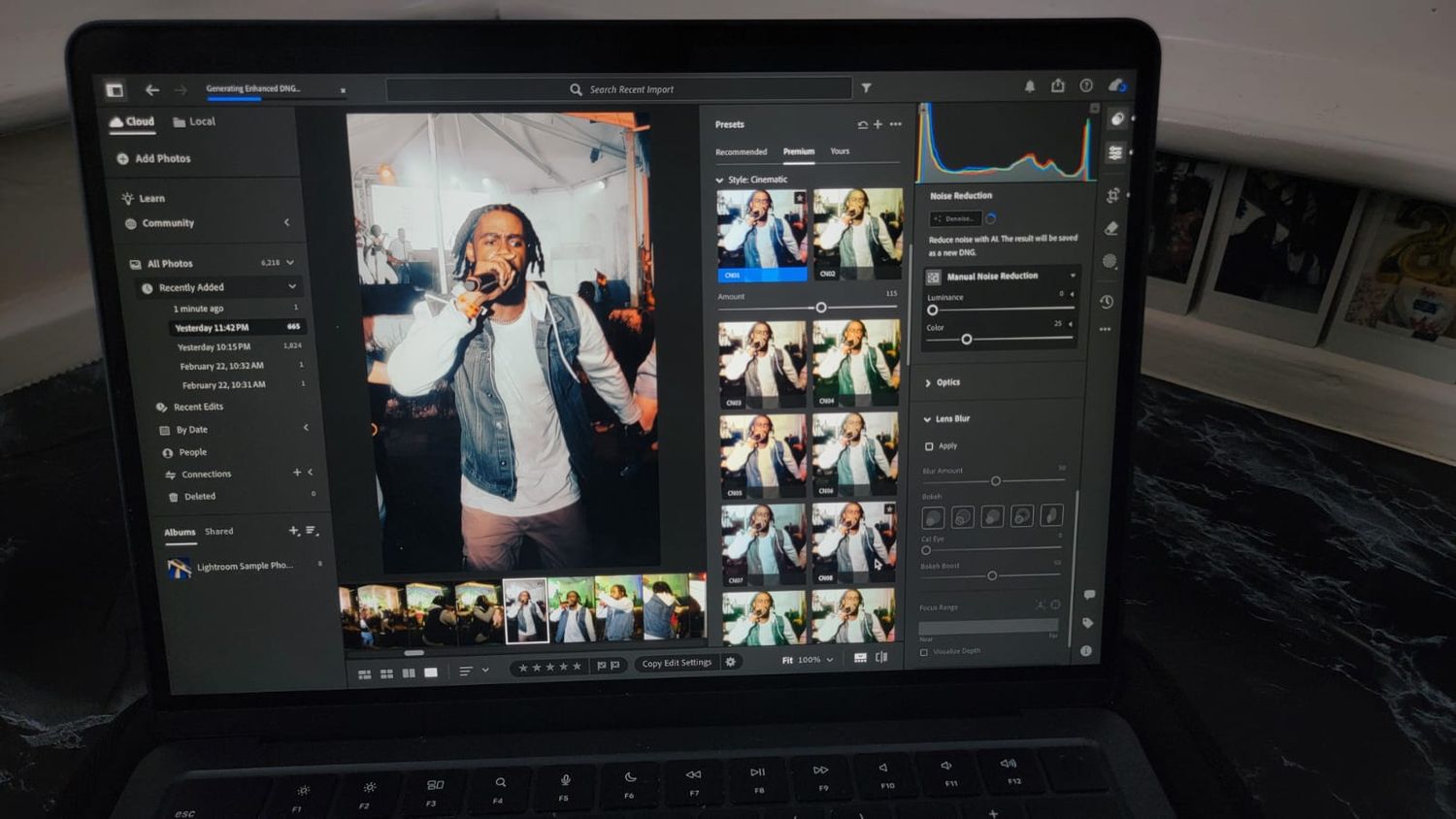 Adobe Lightroom photo editing software interface displayed on a laptop screen showing image thumbnails and editing tools.