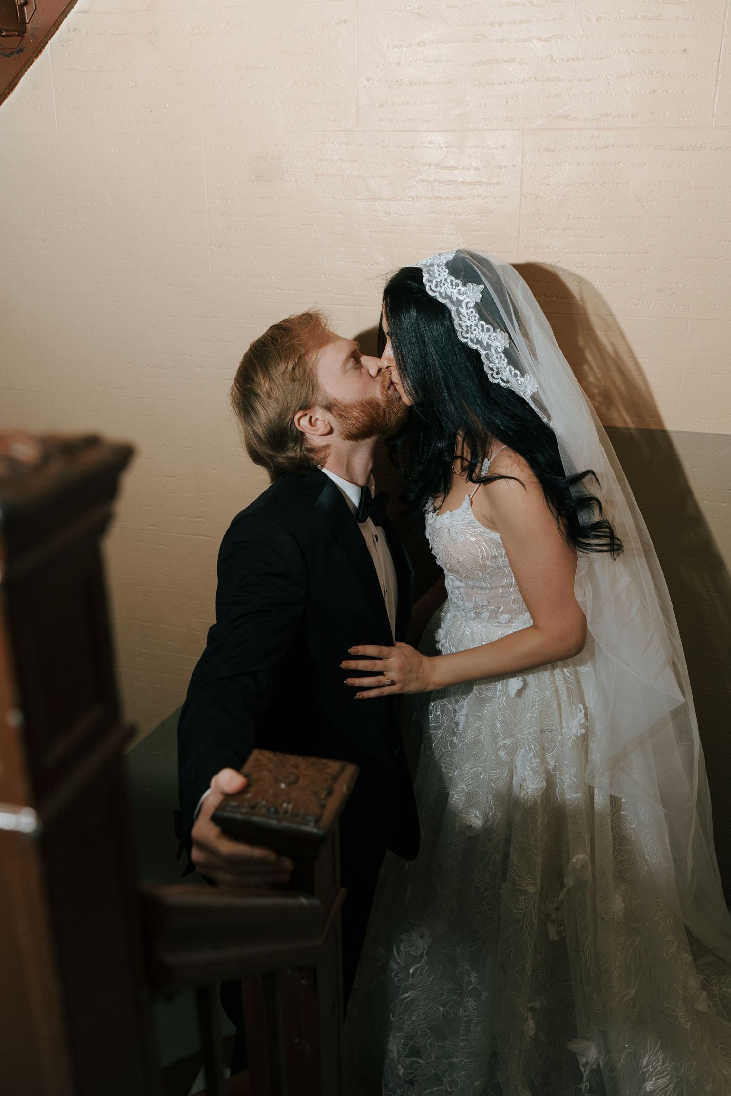 Intimate wedding portrait series capturing romantic kisses between bride and groom.