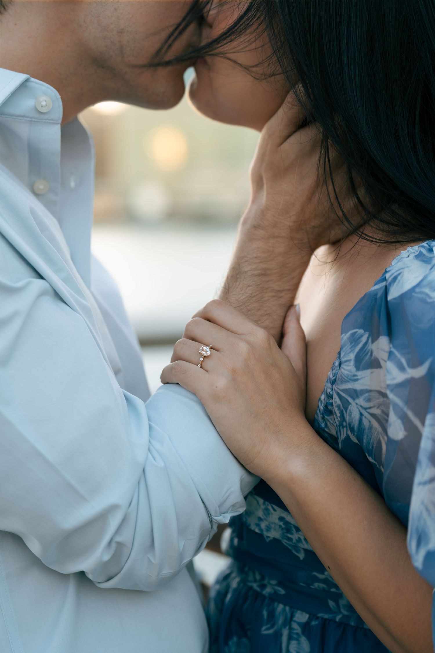 A romantic close-up sequence shows two people sharing tender kisses while wearing blue and white clothing.