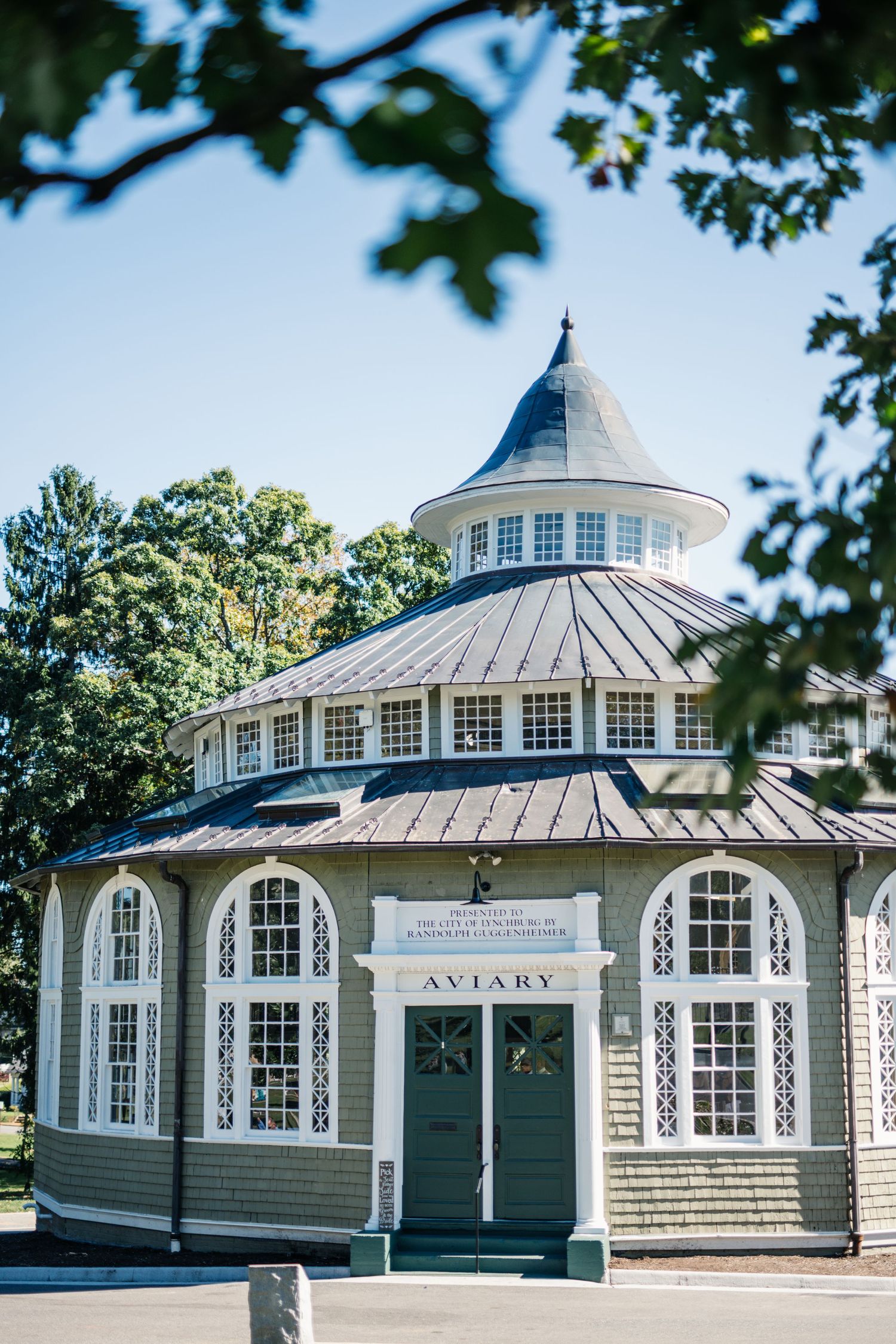 The Aviary, a Victorian-style building with ornate windows and a distinctive cupola.