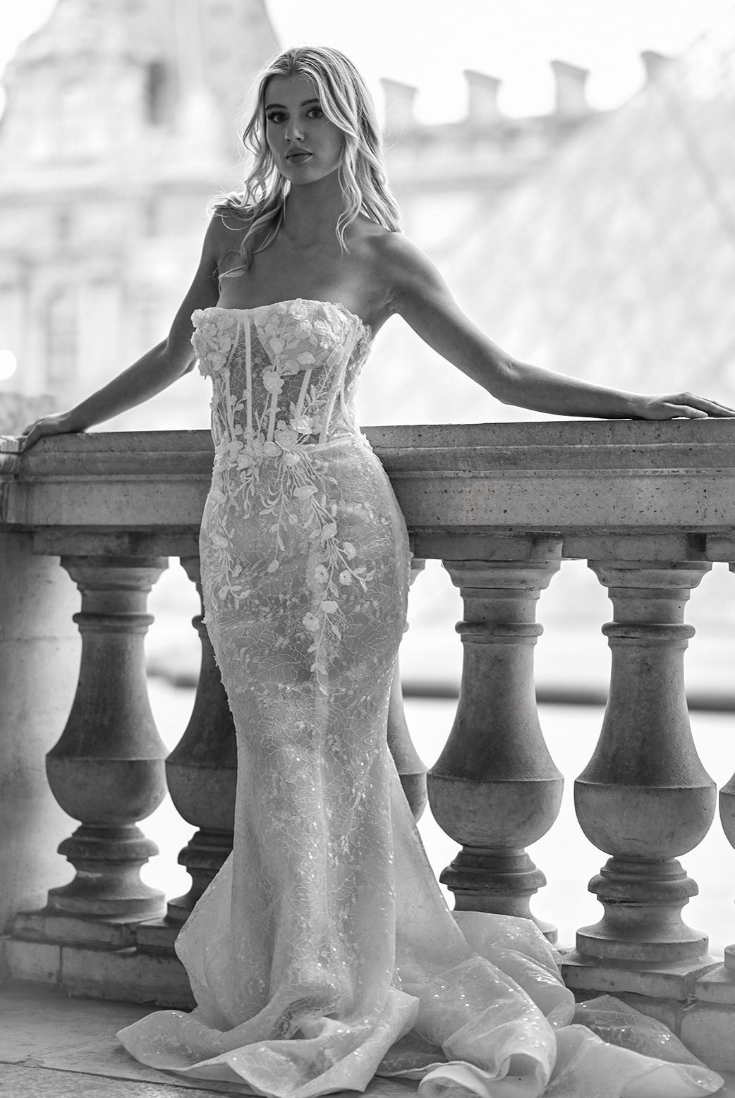 Bridal portrait series showcasing a detailed lace wedding gown against classic architecture.