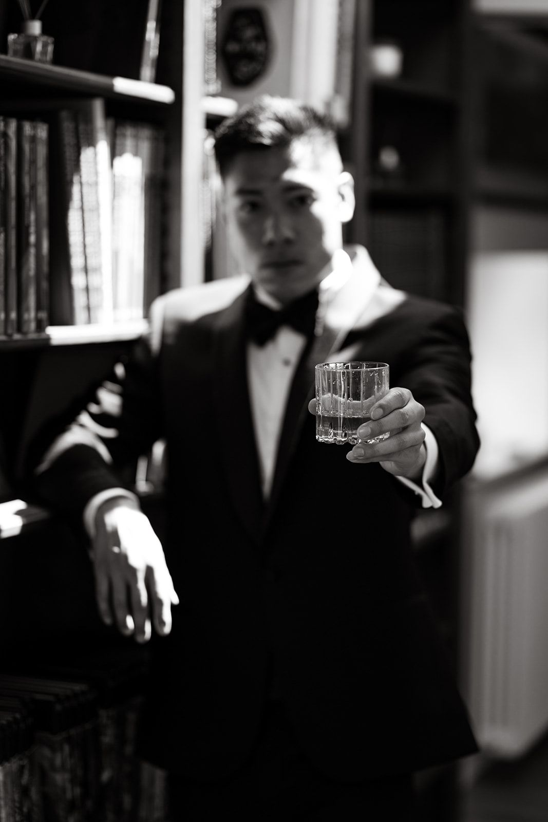 Artistic black and white photo of formal event with glassware.