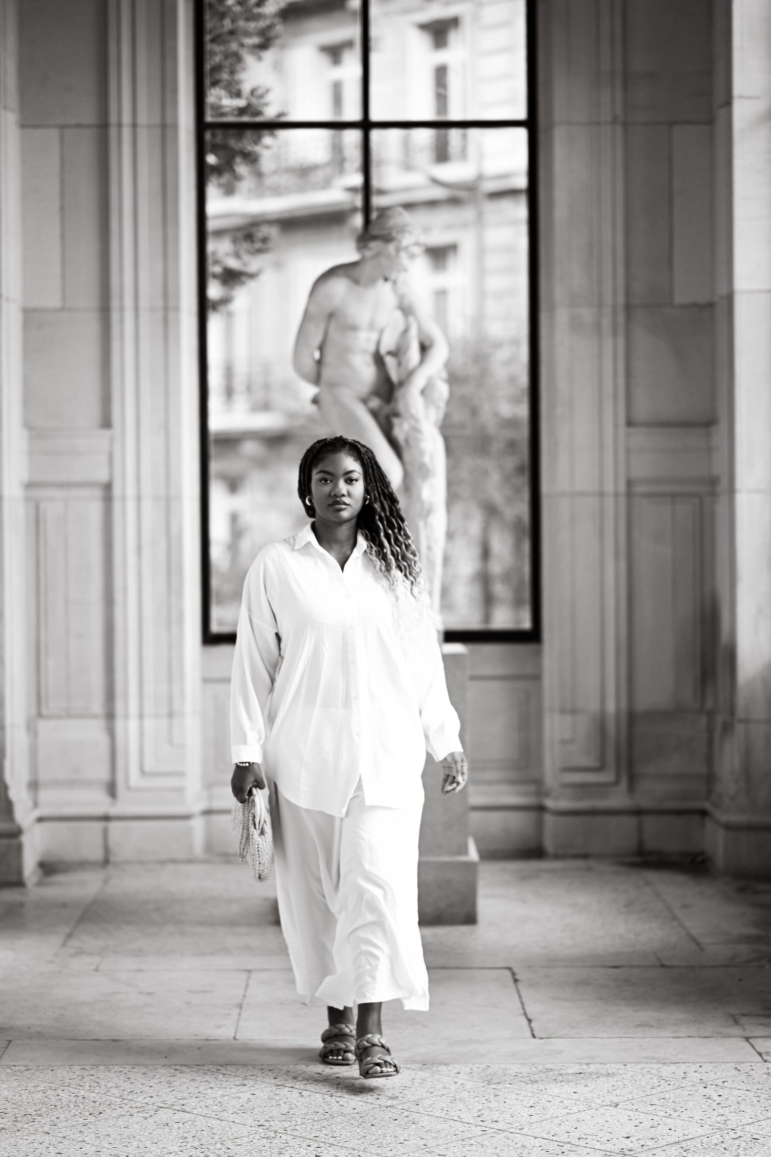 Artistic black and white photo series showing movement through a classical colonnade.