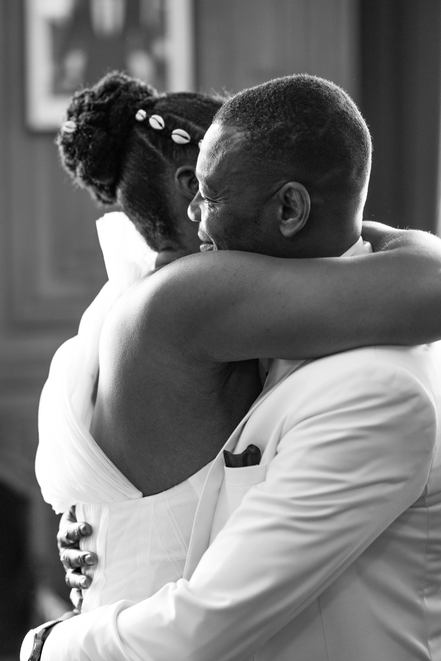 Black and white intimate portraits of a couple embracing during their wedding day.