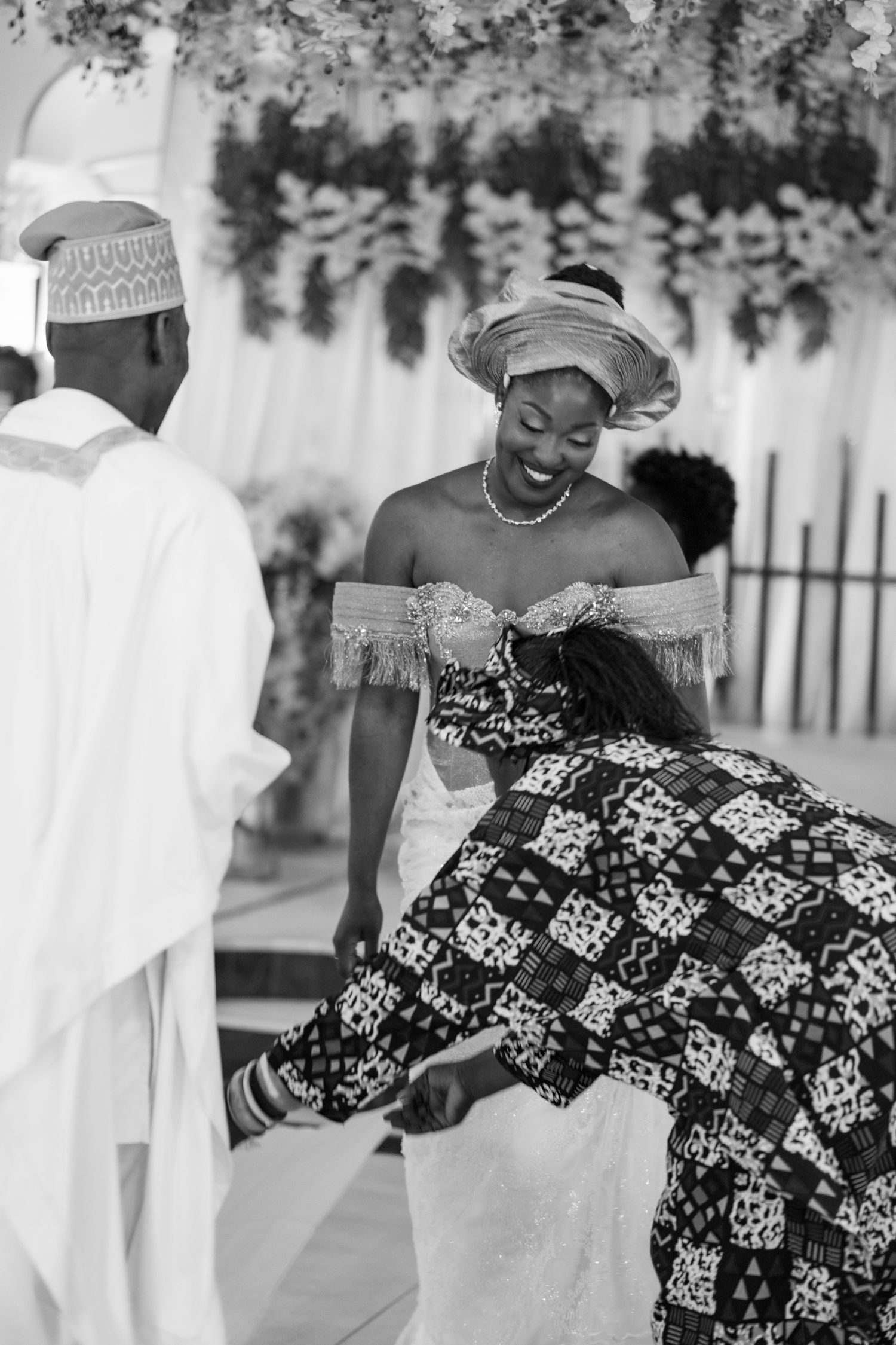Wedding celebration featuring traditional African prints and patterns in black and white photography.