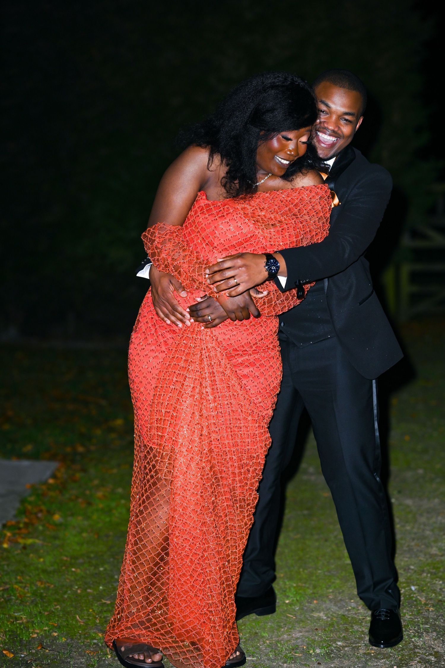 Nighttime photo sequence showing intimate moments in a bright orange dress.