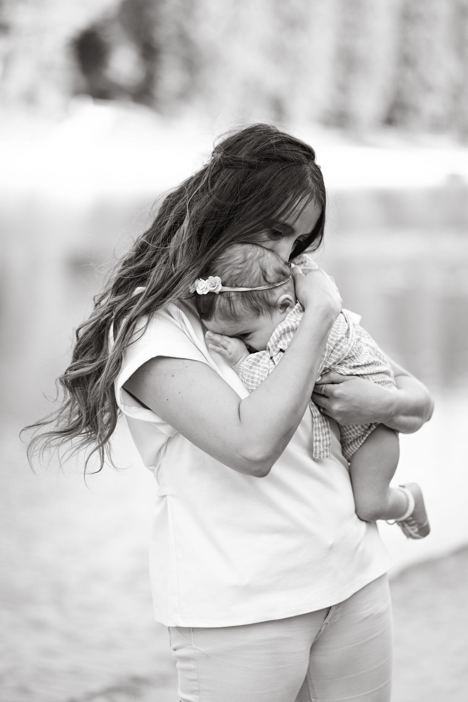 Black and white sequence of tender moments between parent and child.
