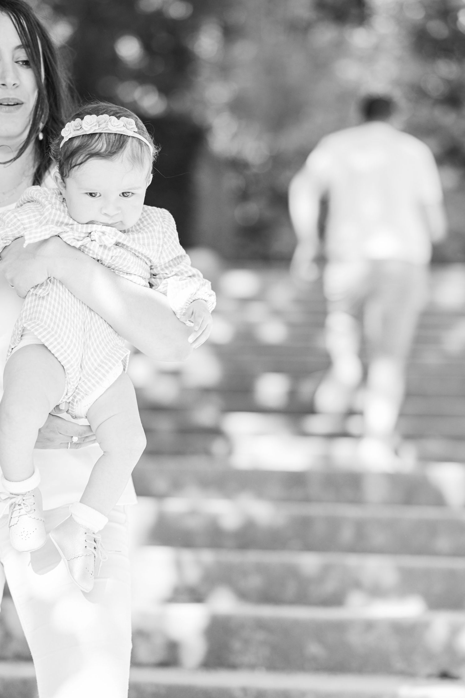 Soft focus black and white portraits showing tender moments in an outdoor setting.