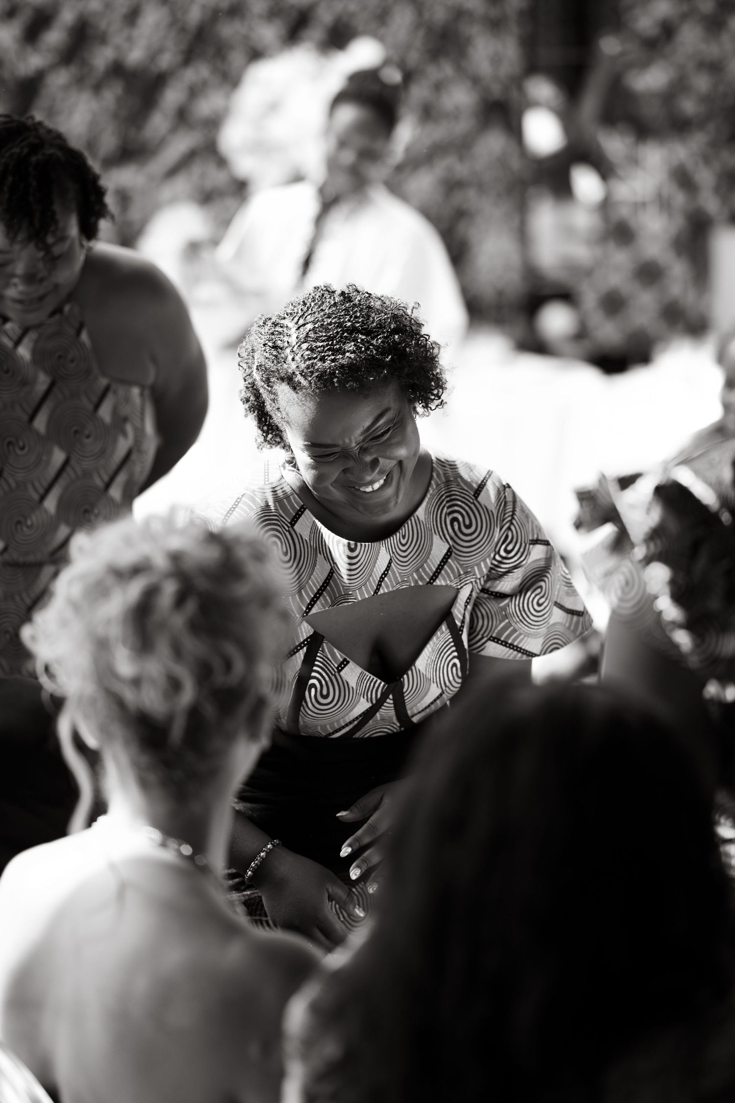 Black and white candid shots of guests enjoying a celebration.