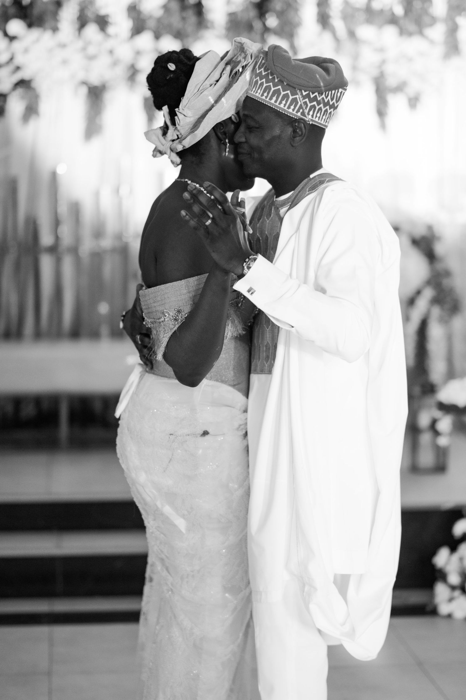 Black and white wedding portraits showing tender moments between a couple.