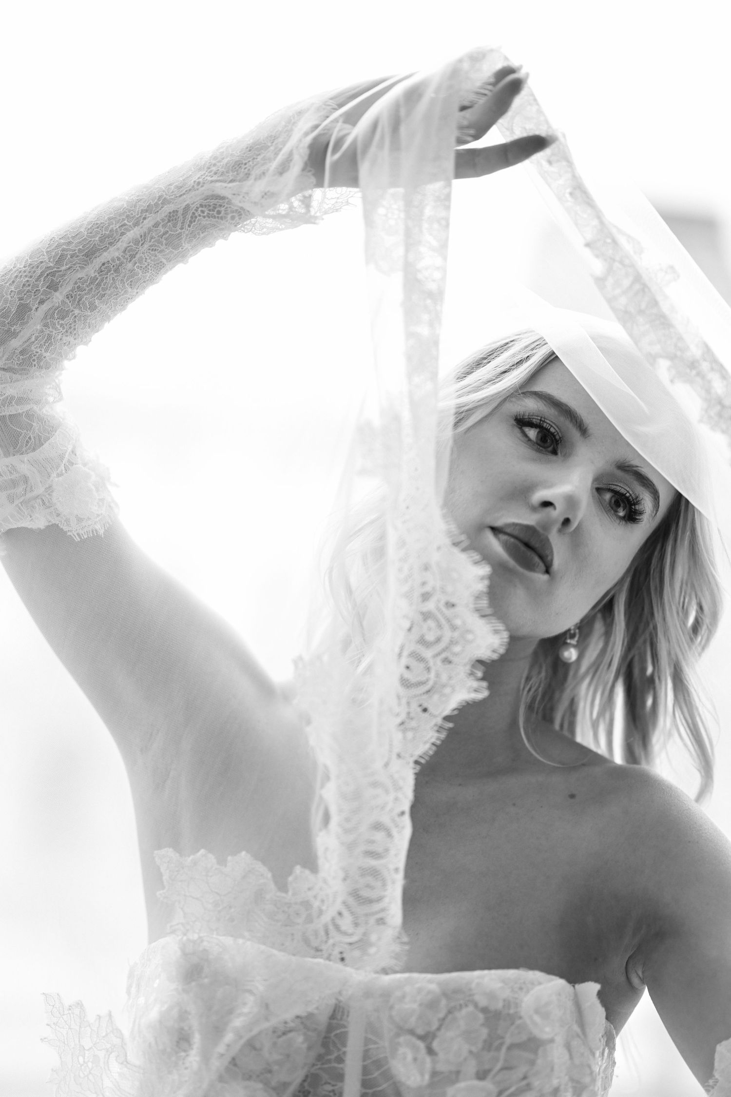 Artistic black and white bridal portraits with ethereal veil effects.