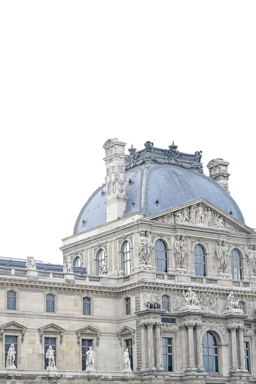 Exterior view of the ornate Louvre Museum architecture in Paris.