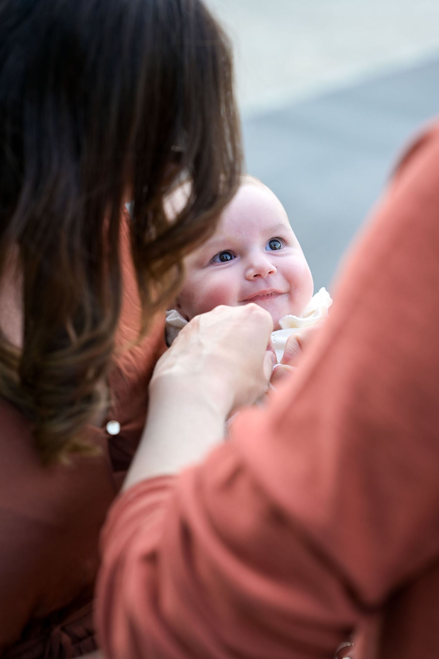 Intimate close-up portrait of tender family moment in soft lighting.