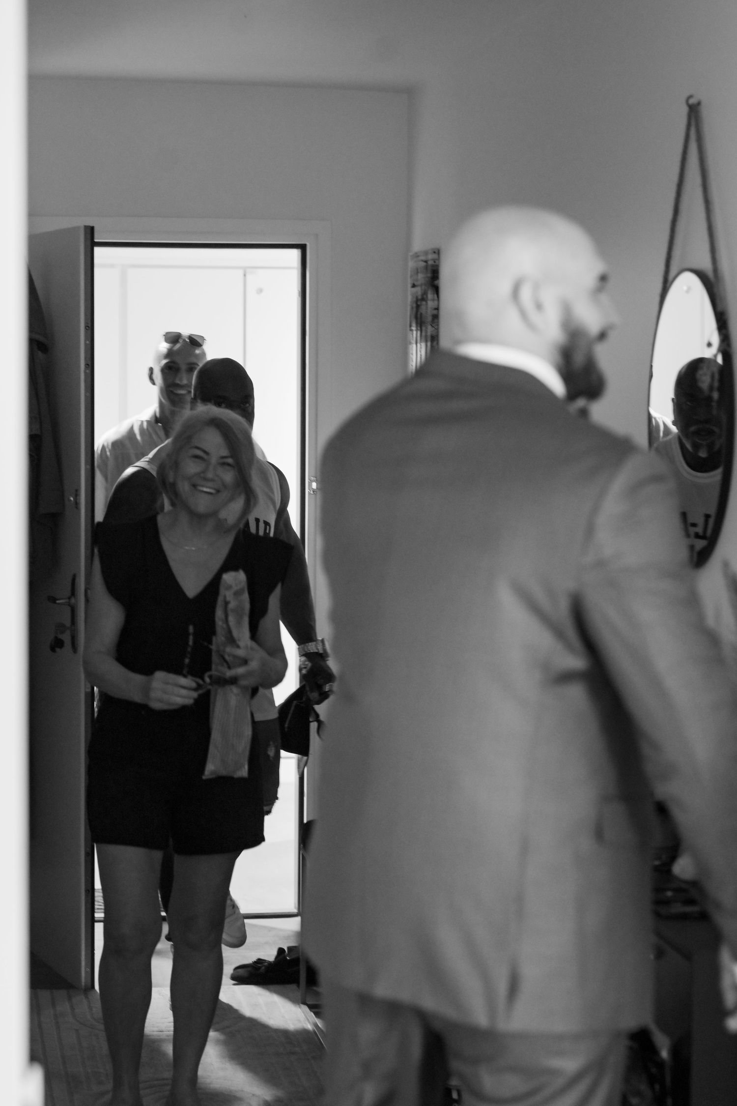 Black and white candid shots of people laughing and interacting.