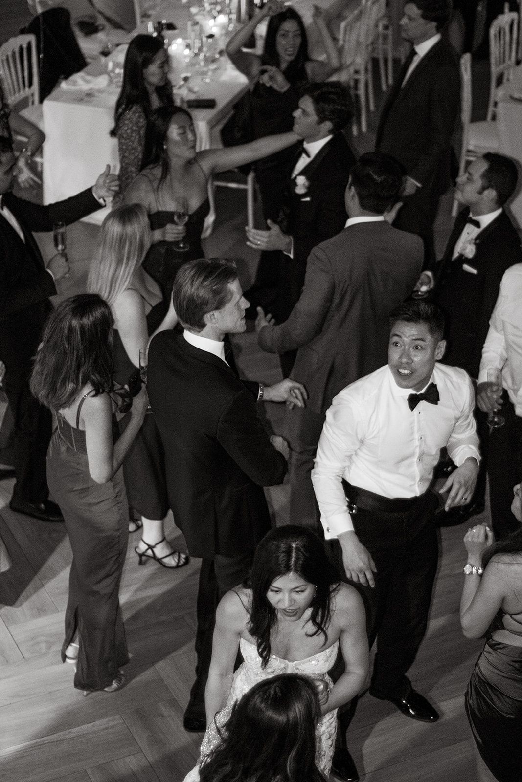 Wedding reception dance floor filled with guests enjoying the celebration.