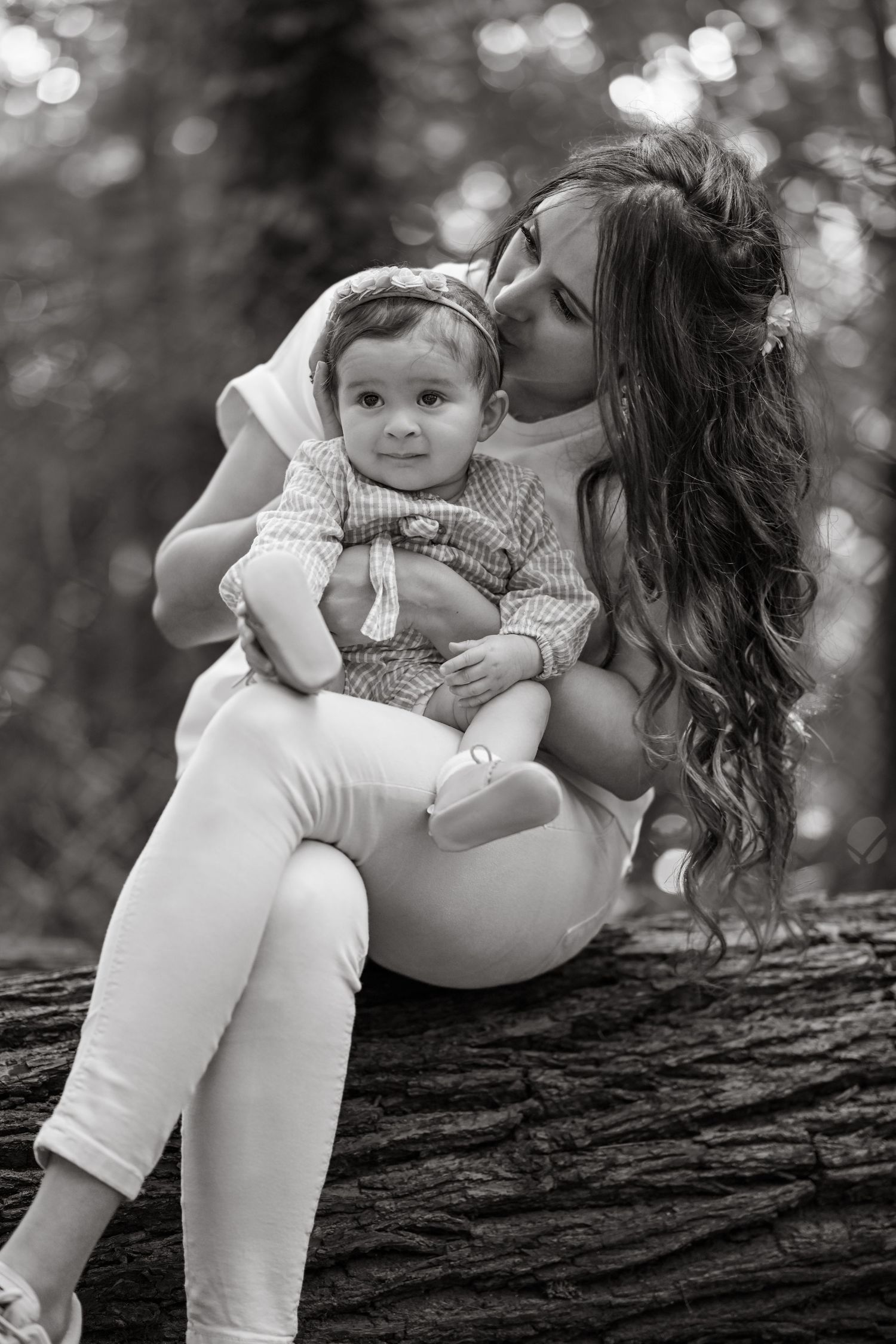 Intimate black and white photography series on a tree trunk capturing candid moments.