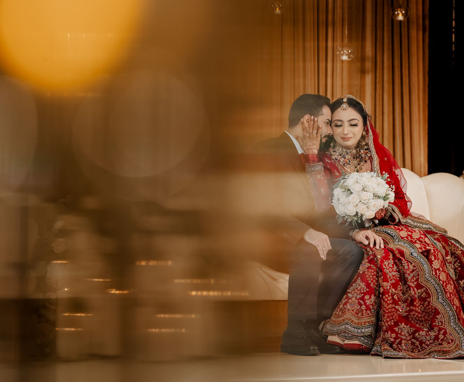 Elegant wedding photo sequence showing couple in traditional attire with warm golden lighting and romantic poses.