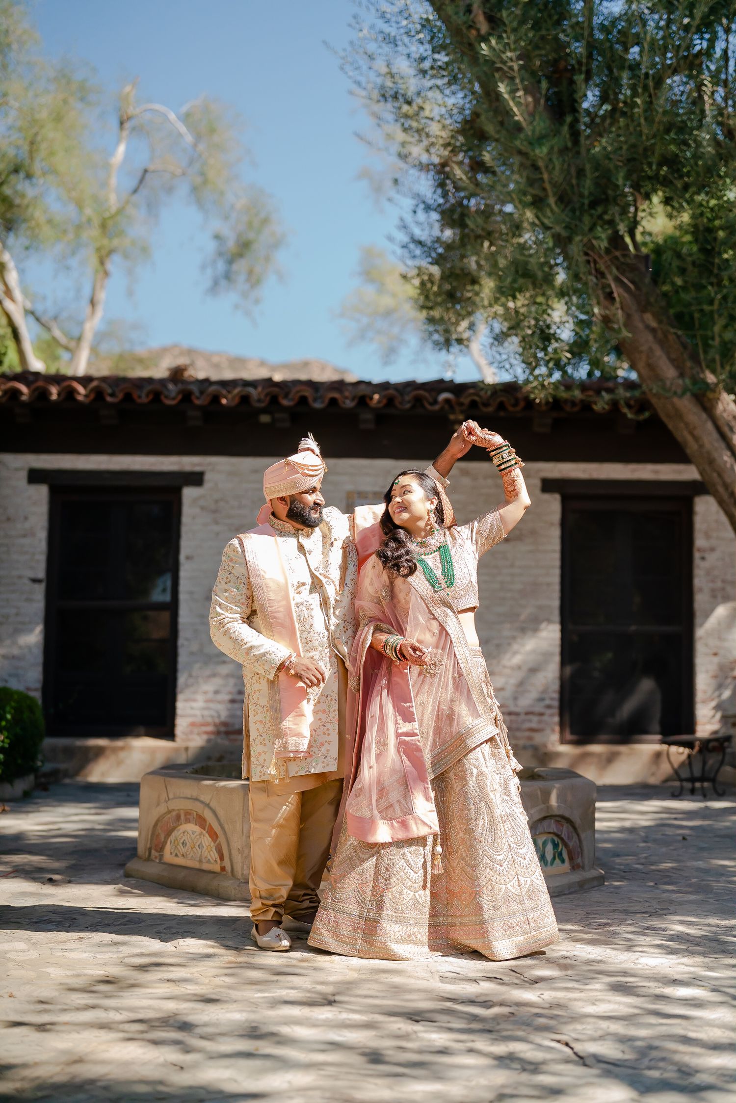A sequence of joyful moments captured at an outdoor venue with traditional South Asian wedding attire and decor.
