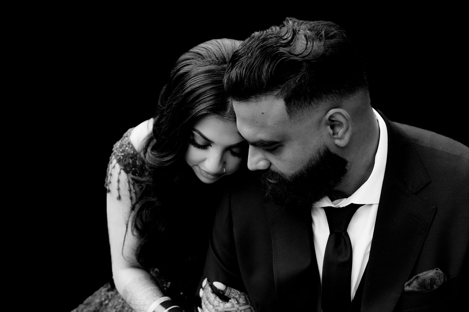 Dramatic black and white romantic portrait with elegant formal attire.