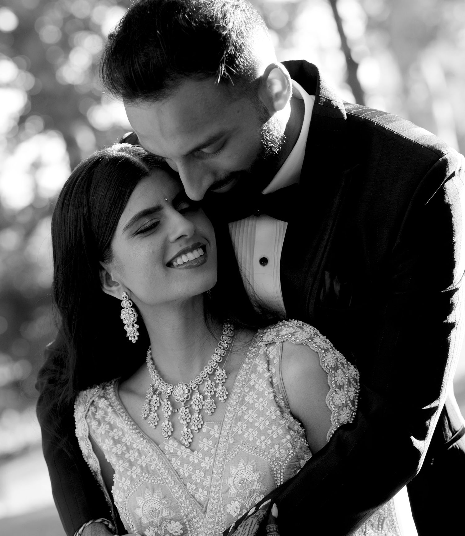Black and white romantic wedding portraits showing tender moments between newlyweds.