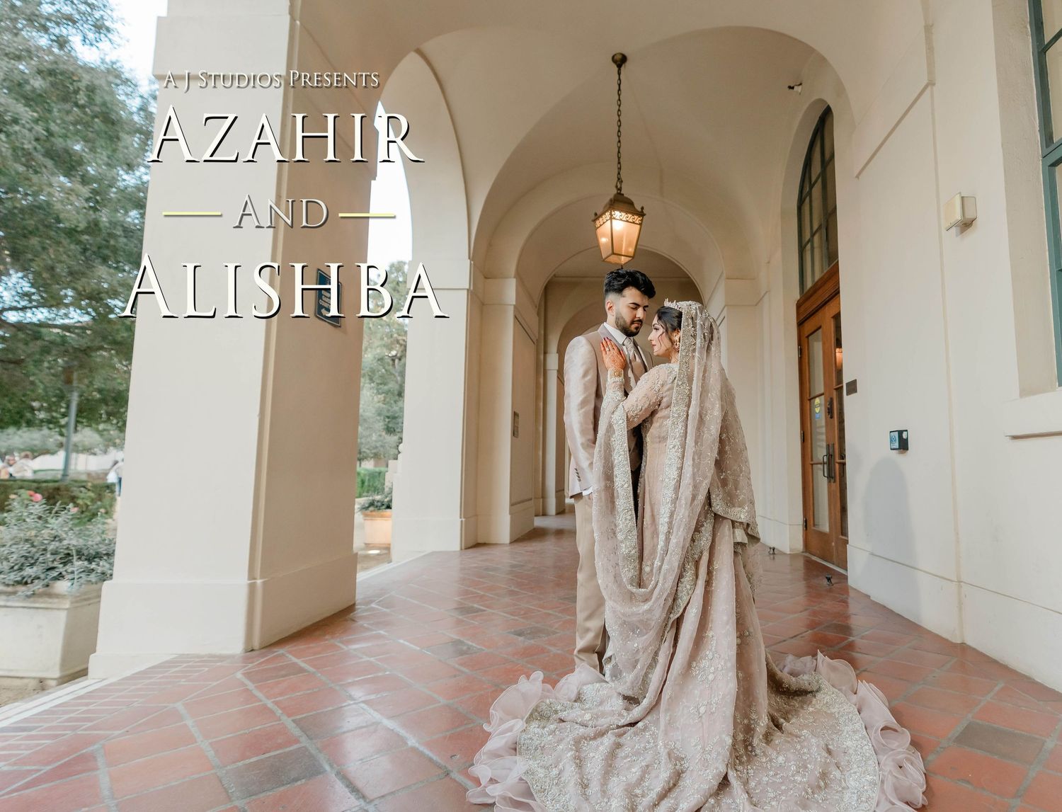 A couple embraces in a romantic moment under an arched colonnade with a flowing champagne-colored wedding dress trailing behind.